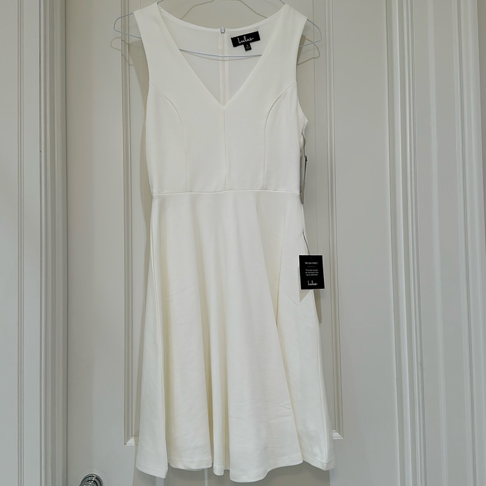 New with tags!!! White mini dress from Lulu’s.